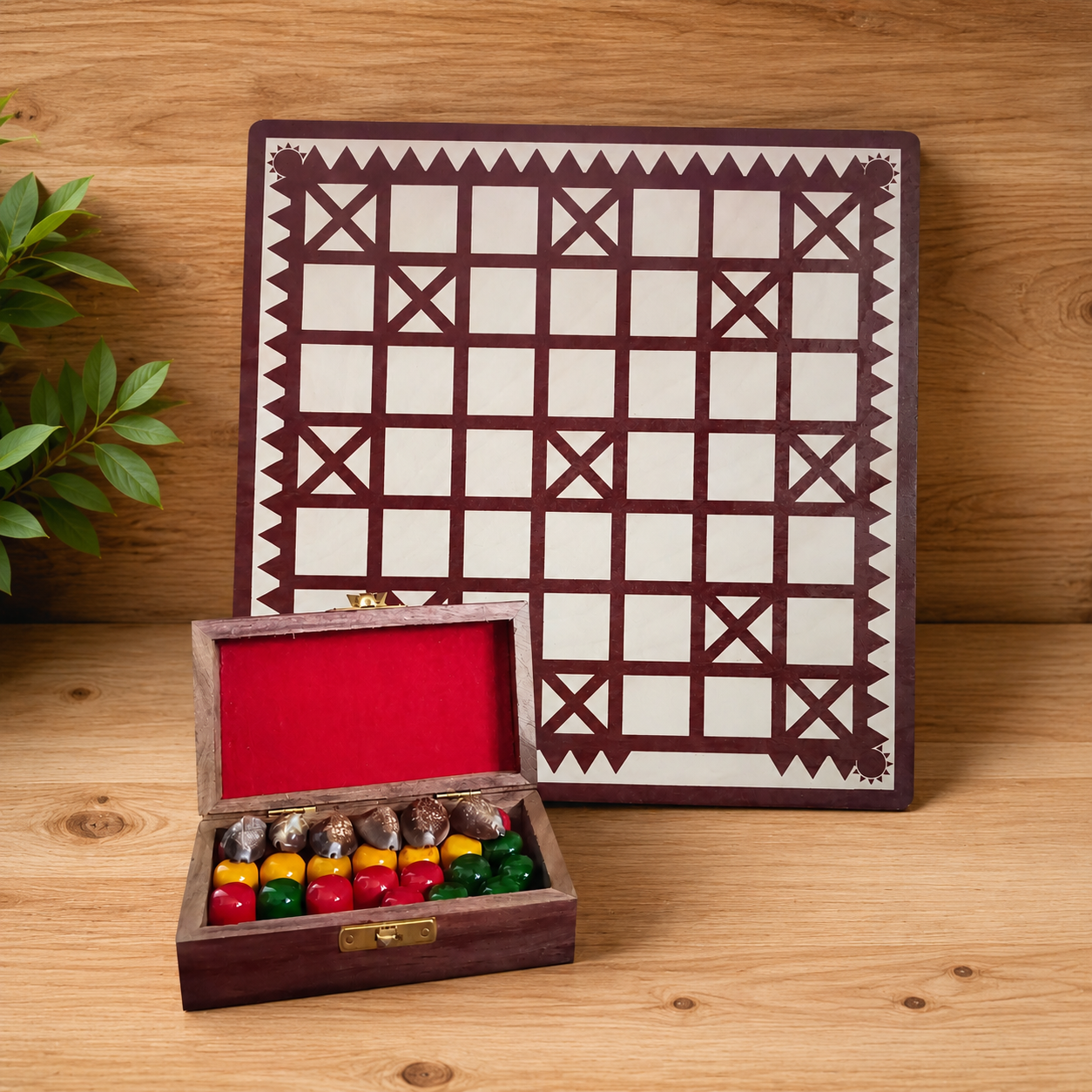 Wooden game board with geometric pattern and a box of colorful game pieces on a wooden surface.
