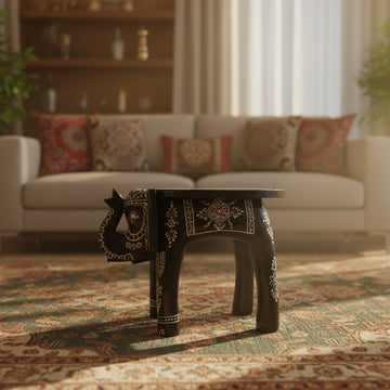 Decorative elephant table in a minimalistic room with a white sofa.